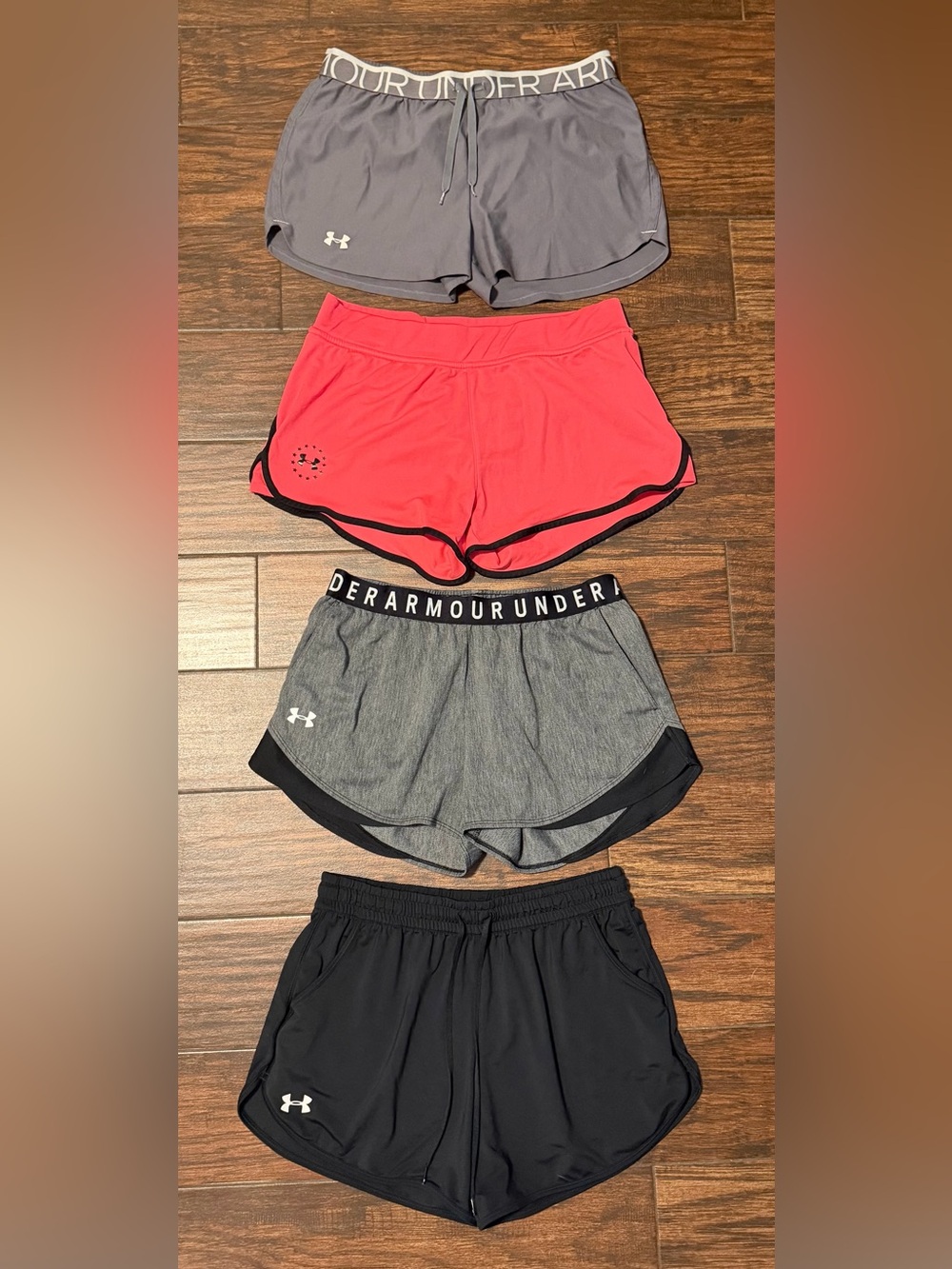 4 pairs of Under Armour Women's Athletic Shorts Pack - Gray, Pink, Black